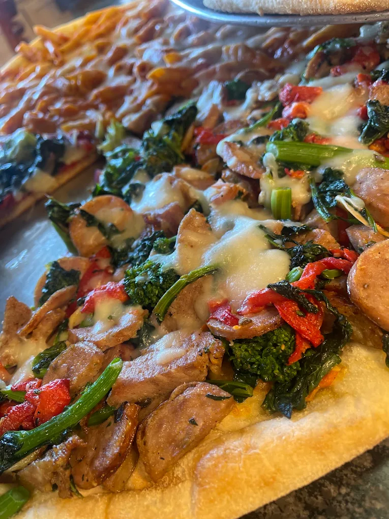 Sausage and broccoli rabe specialty pizza from Pizza Star